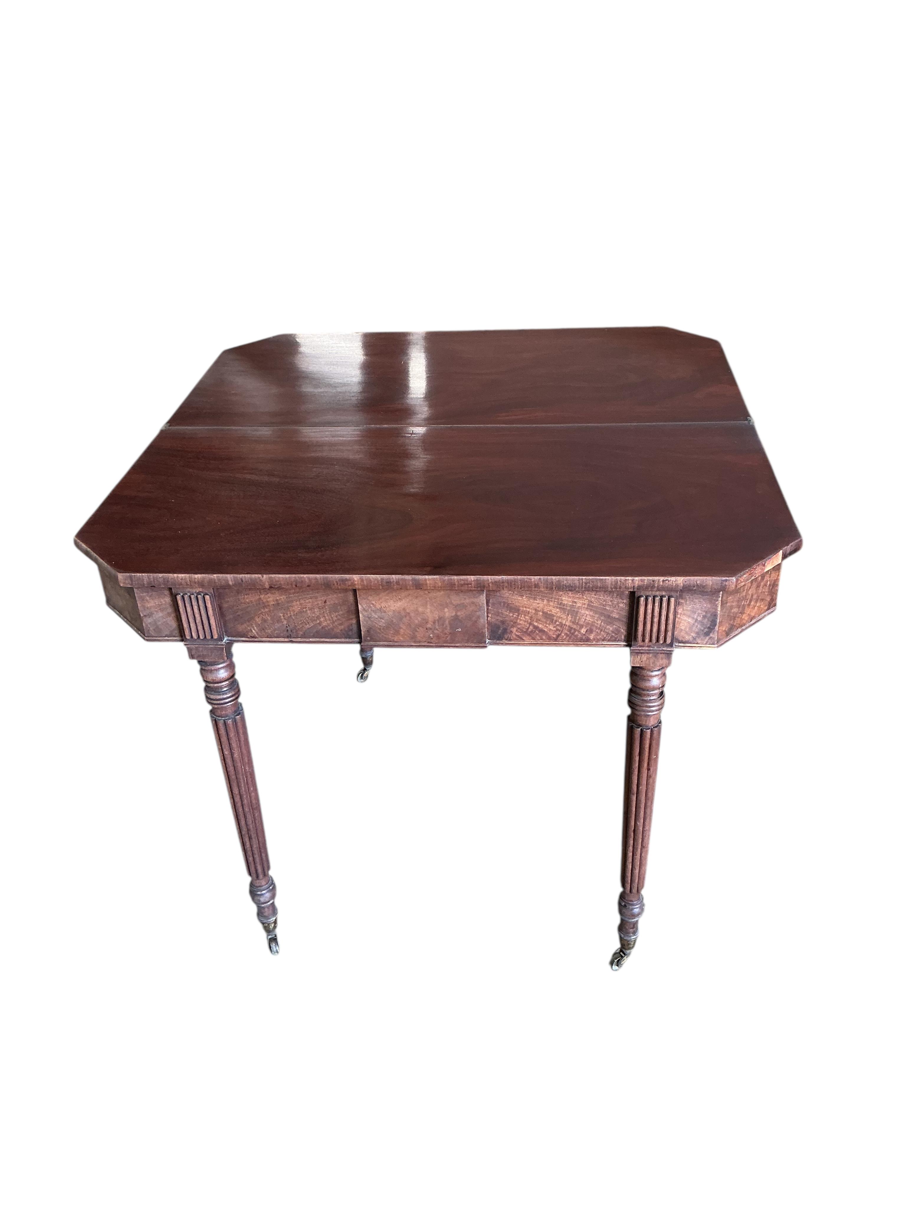 A Regency mahogany folding tea table, width 91cm, depth 45cm, height 74cm